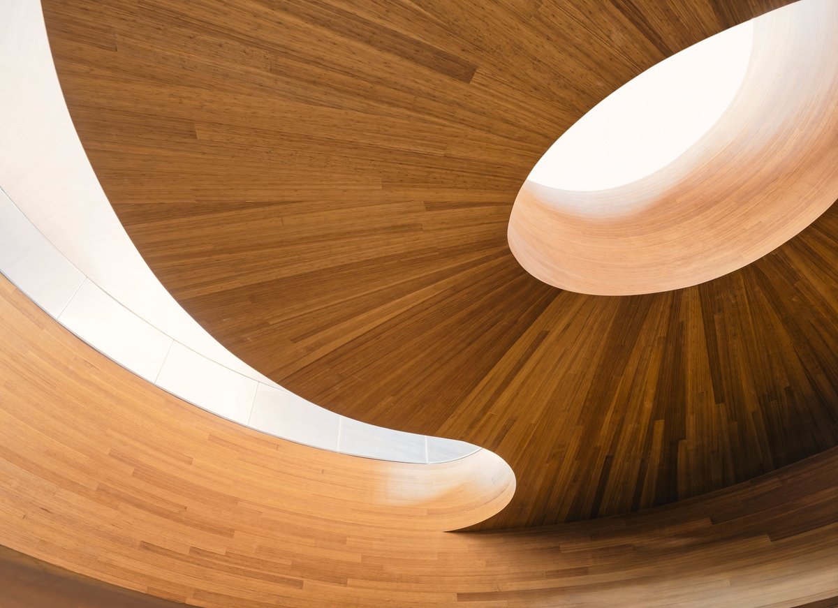 Wooden spiral curve warm color sunlight architecture details